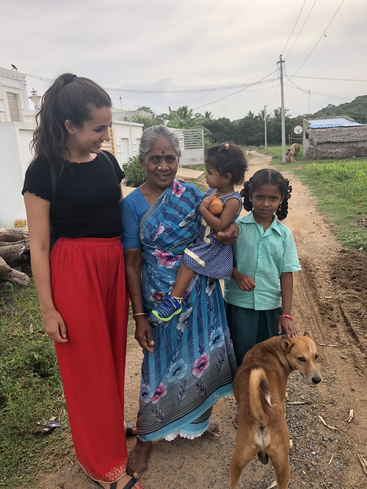 Dr. Emilie Vos with a family in a village near Christian Medical College, India